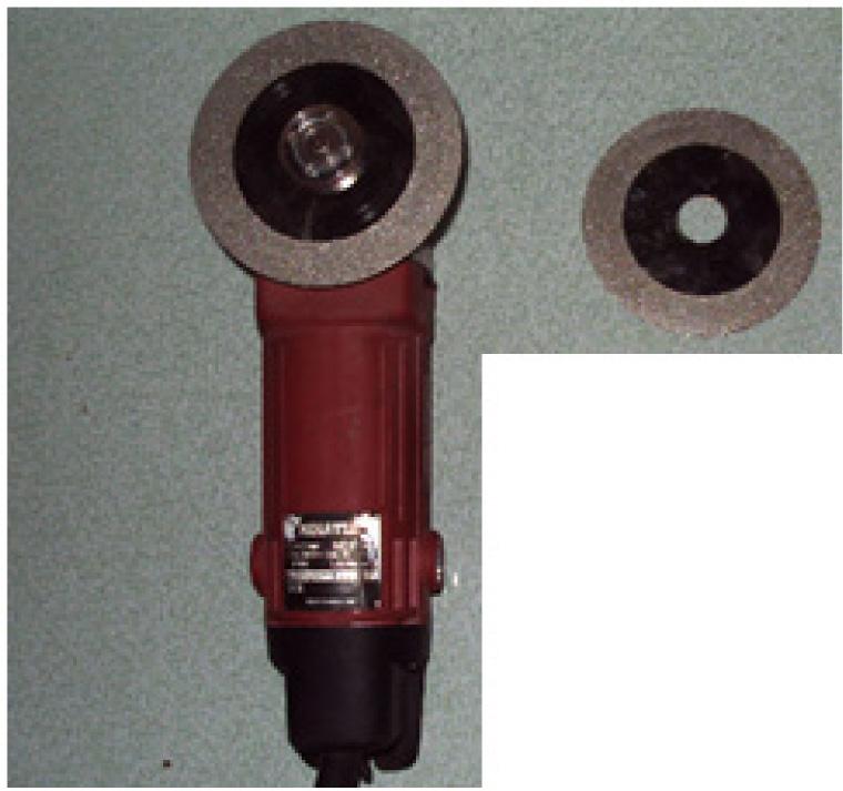 A 100 mm diameter diamond tipped cutting disk mounted on an industrial angle grinder