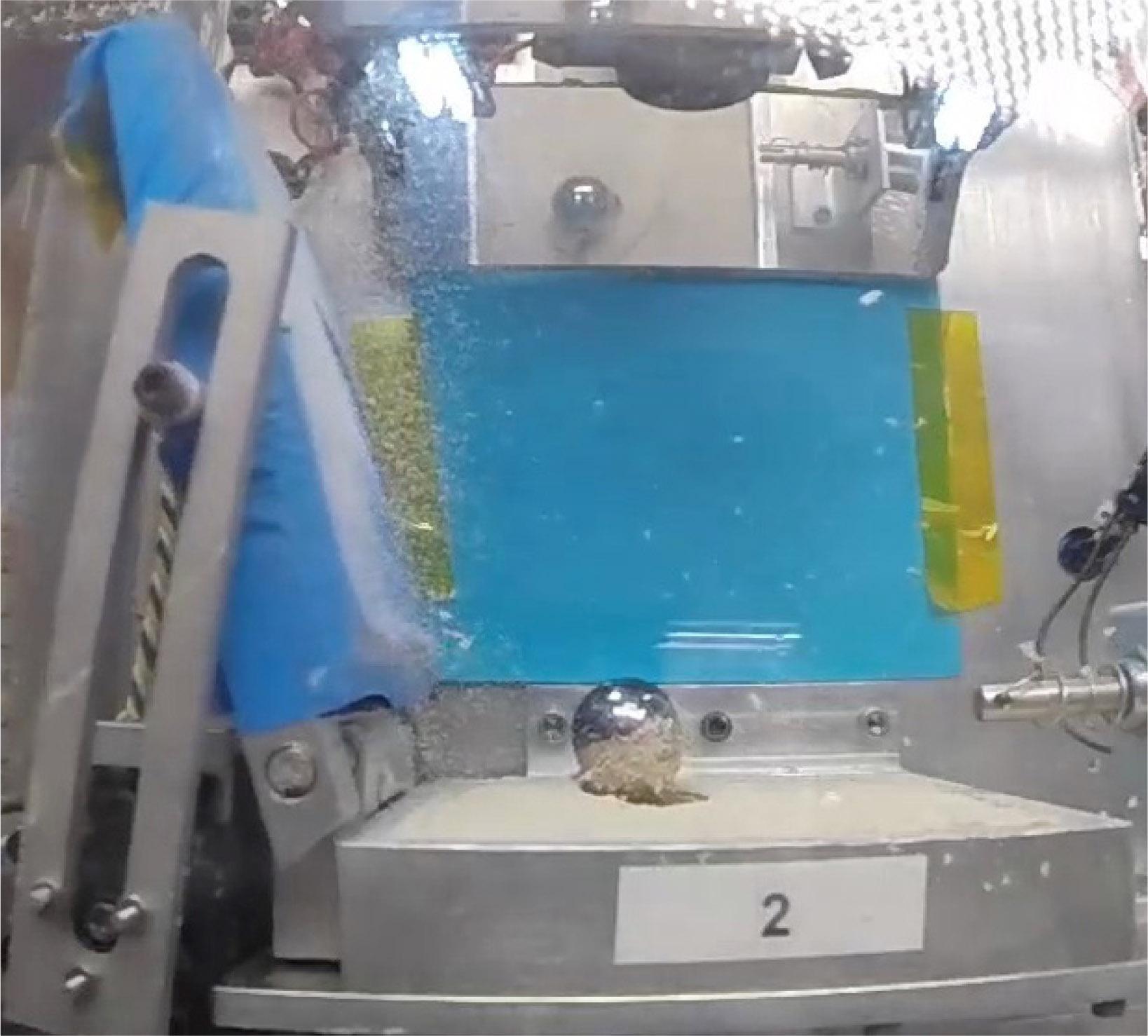 Example of a PRIME-3 experiment that resulted in the mass transfer of quartz sand onto a 31-g steel marble.