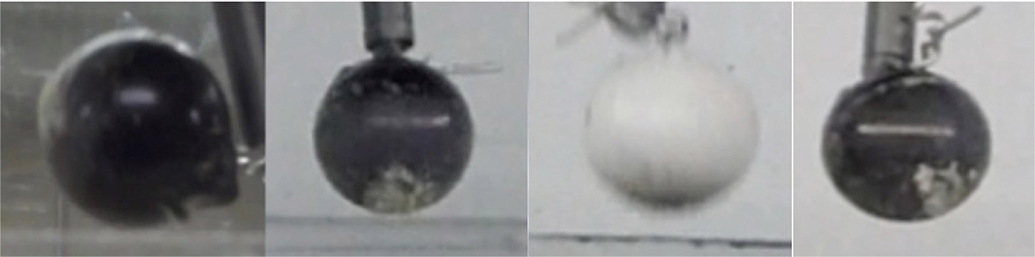 Observations of mass transfer from regolith onto cm-size marble in an open-air, free-fall environment.