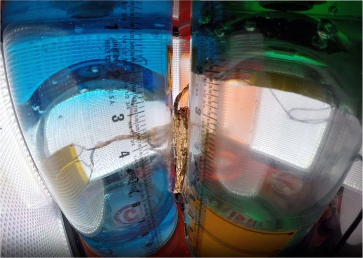 Tanks 3 (Blue) and 1 (Green) imaged 25 s after CCSEP when surface interface motion along the tank wall had essentially stopped. The liquid in each tank, scrambled by the impulse of CCSEP, reached an equilibrium state with roughly half of the volume adhered to the top and half to the bottom of each tank. CCSEP: Crew Capsule Separation.