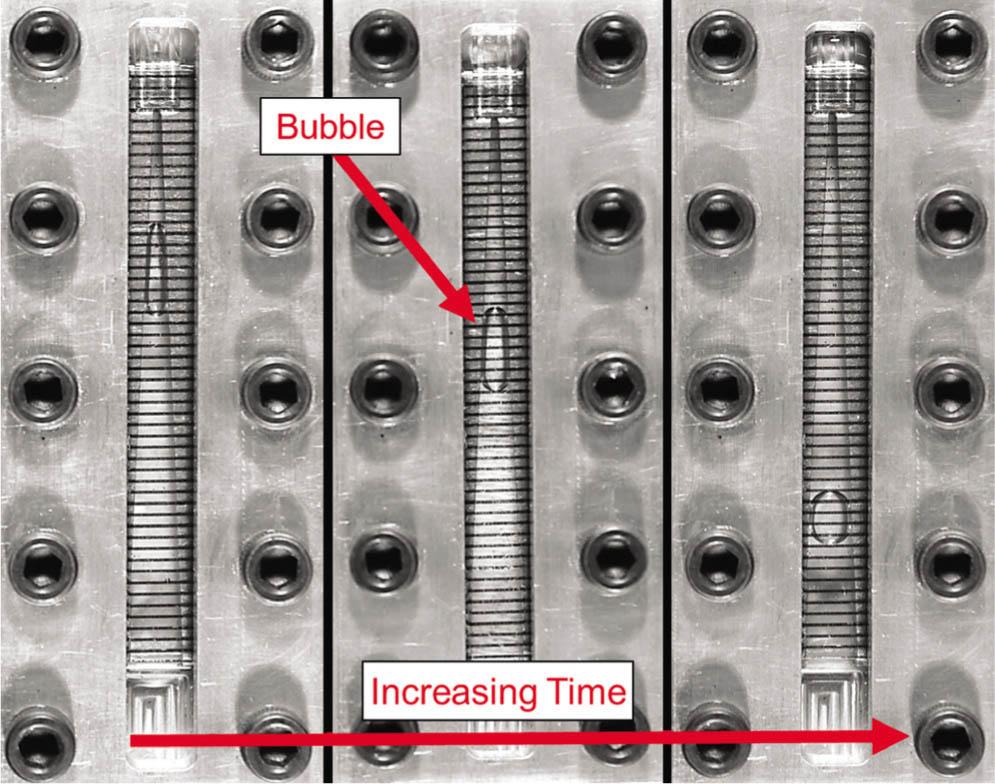 Photograph of bubble migration in a tapered liquid acquisition device.