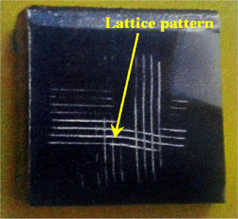 A lattice pattern with six lines in each direction made on titanium coated AA 2024 sample (cross hatch test).