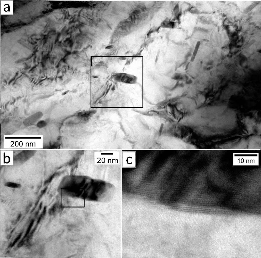 (A) Bright-field image of LTHAZ. Visible cementite precipitations inside bainitic ferrite, dislocations, and areas indicated the stress fields. (B) Magnification of coarse cementite precipitations, dislocations, and stress fields. (C) Incoherent cementite precipitation with ferrite matrix in the area marked in the frame in Figure 7B. HRTEM, 200 kV. HRTEM, high-resolution transmission electron microscopy; LTHAZ, low-temperature heat-affected zone