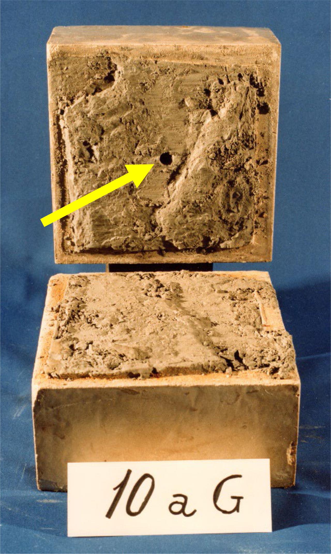 Campolattaro marl specimen subjected to direct shear test (the arrow indicates the hole in the middle for the rock joint saturation) (after ISMES 1982)
