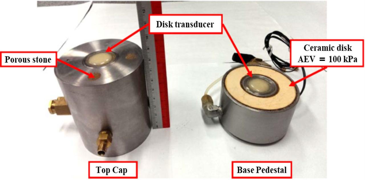 Modified pedestal and top cap of triaxial apparatus, fitted with disk-type piezoelectric transducers at their respective centers.