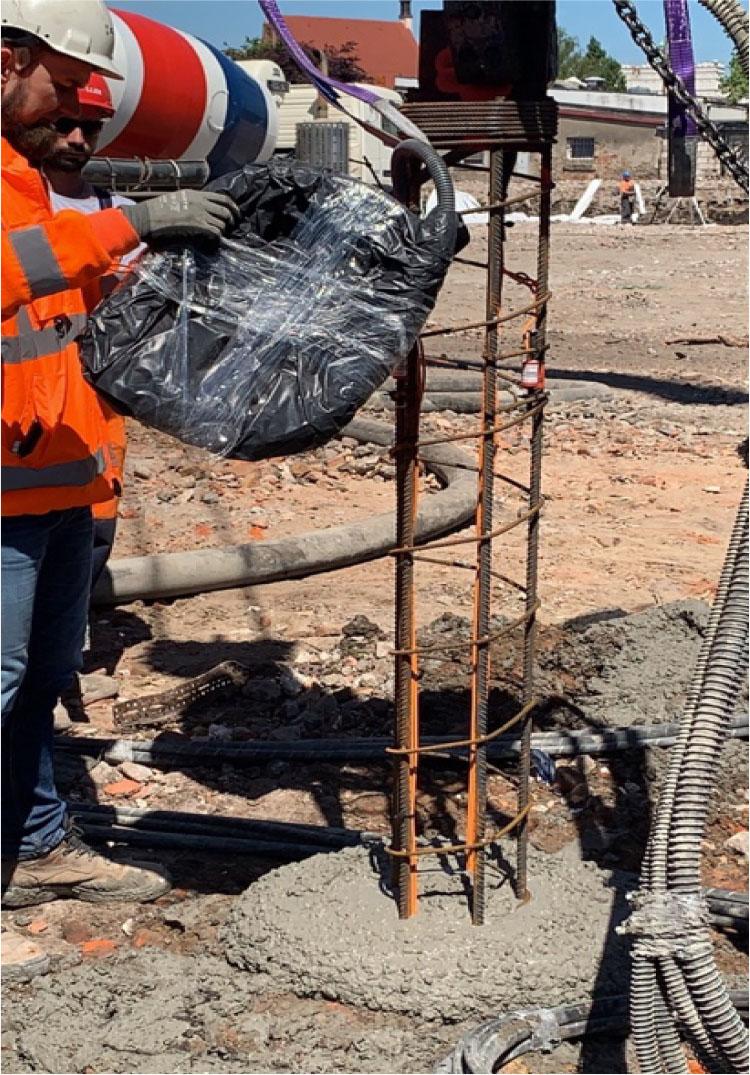 Pile designed for testing with visible extensometers attached to the reinforcing steel while casting (image captured by the author).