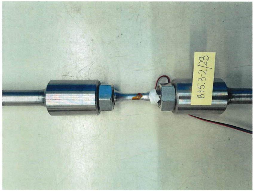 Sample number 2a in the holders after fatigue testing.
