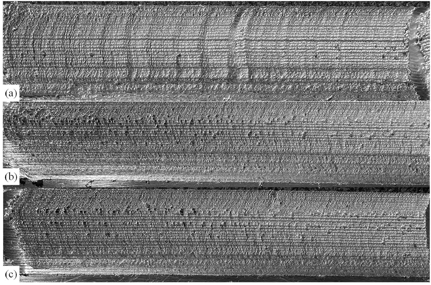 Surface morphology of the additive zone with different traverse speeds: (a) 23.5 mm/min, (b) 37.5 mm/min, and (c) 47.5 mm/min.